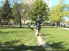 Teen peeing in a public park