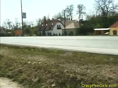 young teen peeing on street