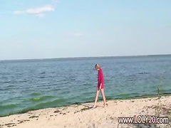 Shy nude girl on the beach